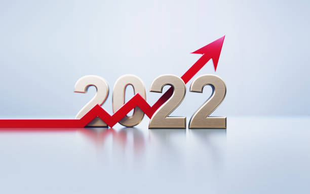 istock Red Arrow And Gold Colored 2022 Sitting Over Gray Background 1428804287
