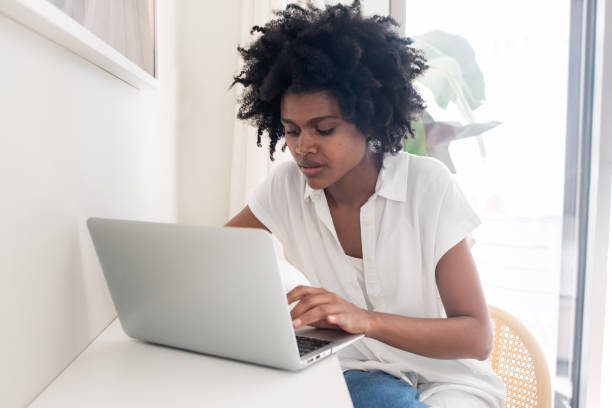 istock Focused businesswoman typing on laptop while working from home 1428805031