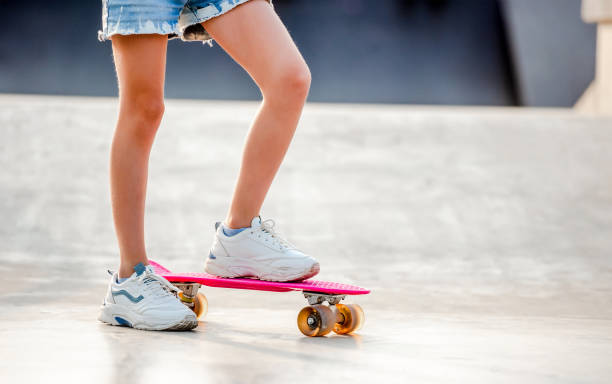 istock Girl with skateboard outdoors 1428807995