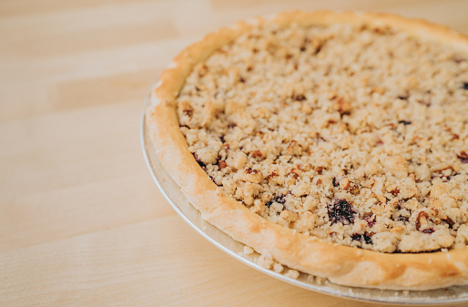 Pie with blueberry and sour cream with a pecan crumble
