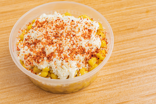 Elote with crema and paprika