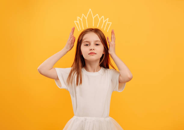 istock Girl isolated on yellow background 1428812547