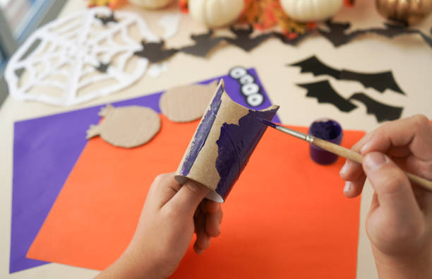 istock Step by step instruction - 4 - Decorations for Halloween party from toilet roll. Easy eco-friendly DIY master class, craft for kids. Development imagination and sensory motor skills 1428813967
