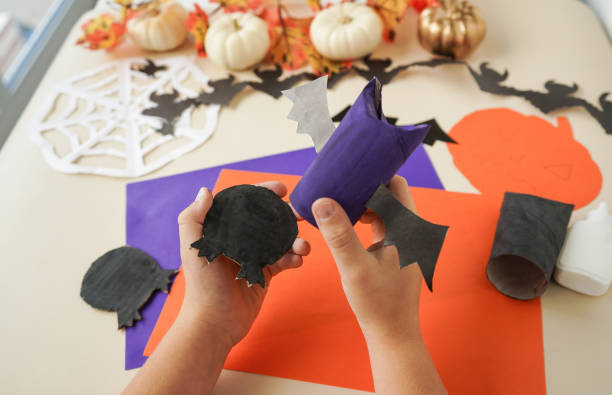 istock Step by step instruction - 6 - Decorations for Halloween party from toilet roll. Easy eco-friendly DIY master class, craft for kids. Development imagination and sensory motor skills 1428813994