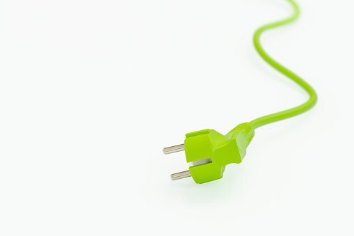 Green power plug on white background, Copy space,Concept, Green energy and renewable resources