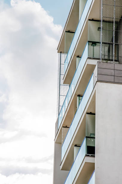 istock Modern Apartments with Balconies Against Clear Sky 1428816569