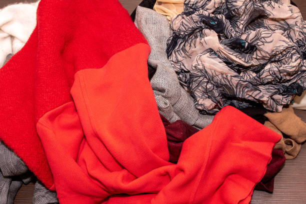 istock Ple of messy wardrobe textile 1428817249