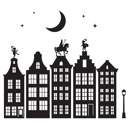 Celebration Dutch holidays - Saint Nicholas or Sinterklaas is coming to town at night - silhouette