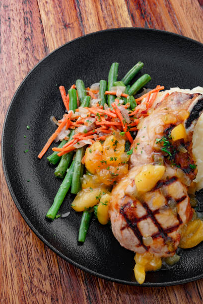istock Pork Chops with Mashed Potatos and Vegetables 1428818114