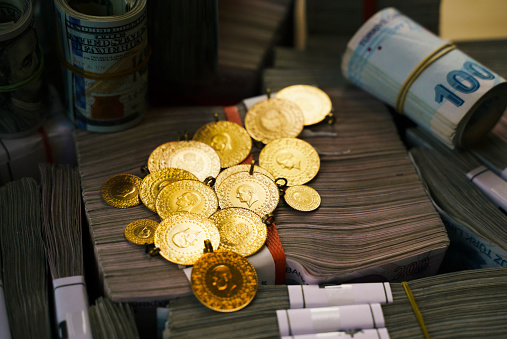Large group of Turkish Lira banknotes with gold coins