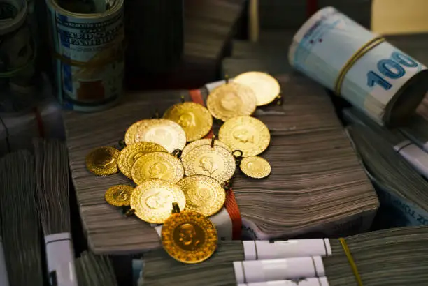 Photo of Large group of Turkish Lira banknotes with gold coins