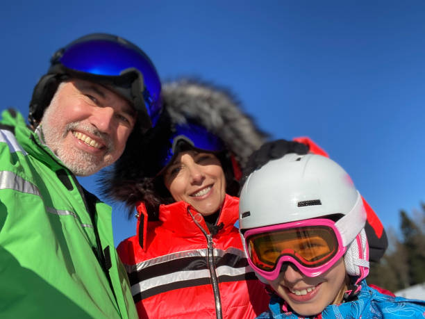 istock Family enjoying an active  day on a ski slope 1428827996