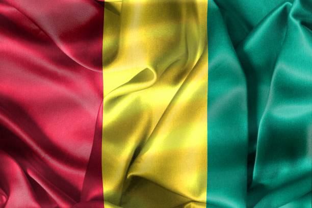 istock Guinea flag - realistic waving fabric flag 1428837431