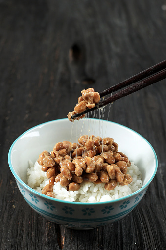 Natto Japanese Fermented Soybeans with White Rice in Ceramic Bowl