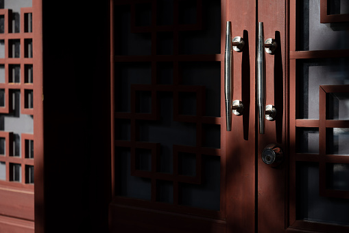 Metal handle on Chinese red wooden door