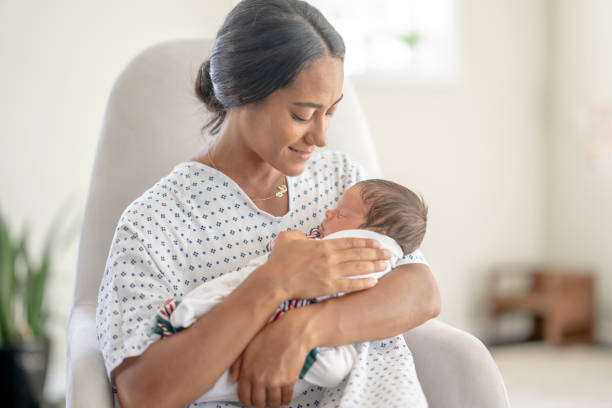 istock Mother Cradling Her Newborn 1428852186