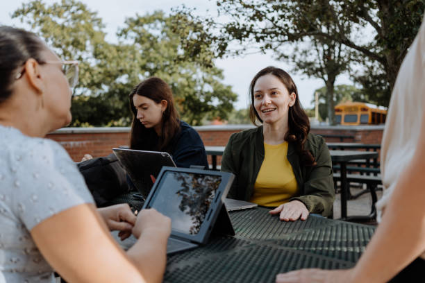 istock Teacher giving lessons outside the classroom 1428859910