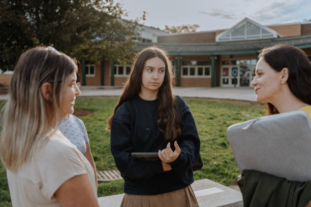 istock Teacher giving lessons outside the classroom 1428860595