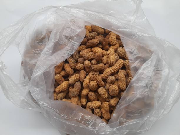 istock Peanut shell (Arachis hypogaea L) food on plastic top view on white background 1428866291
