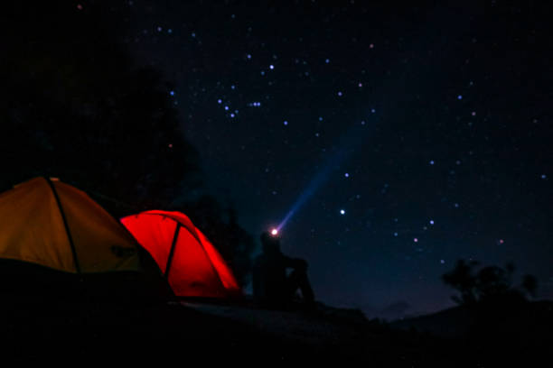 istock Night Atmosphere with Climbers Sitting Beside the Tent 1428872077