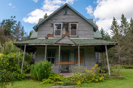 An old abandoned home sits crumbling and rotting away in a rural area on St. Joseph Island in Ontario.
