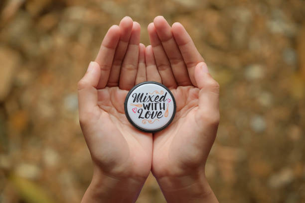 istock Hand holding keychain with quote mixed with love on blurred background, high angle shot 1428876531