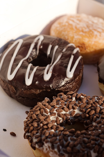 a box of donuts with flavors, fillings, and chocolate jam perfect for breakfast or a snack with coffee