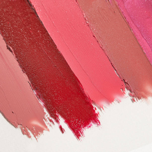 istock Red, pink, violet and nude lipstick swatshes texture with copy space. 1428900450