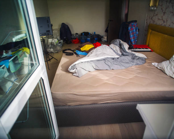 istock unmade bed and messy room 1428907137