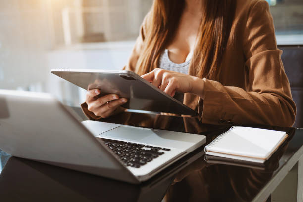 istock Working Process in Modern Office. Young Woman Account Manager Working at Wood Table with New Business Project. 1428908221