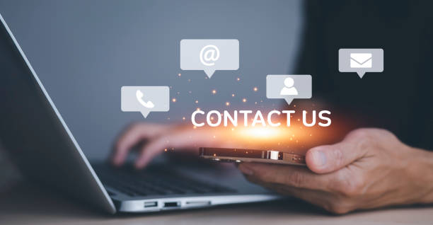 istock Communication and Contact us or Customer support hotline people connect. Hand using a laptop and touching on virtual screen contact icons, email and address, live chat with internet wifi. 1428910785