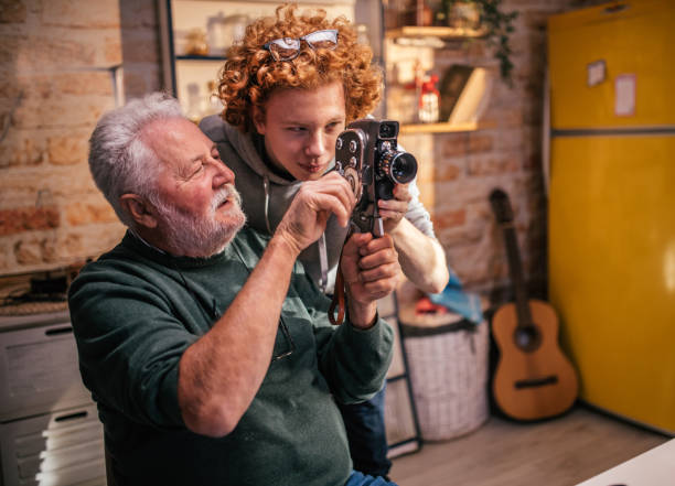 Photographer shooting a picture with his digital camera, close up