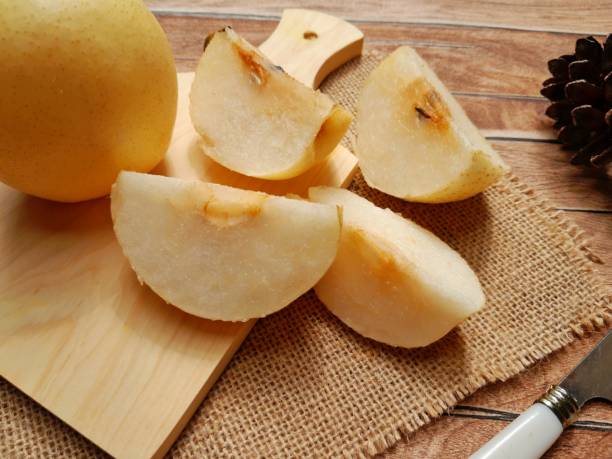 istock close-up of a pear cut into several pieces 1428919664