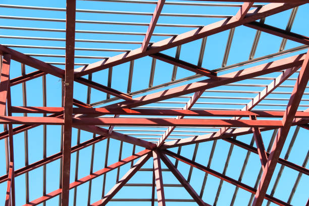 istock Roof metal house structure on bright blue sky background , construction site background 1428923090