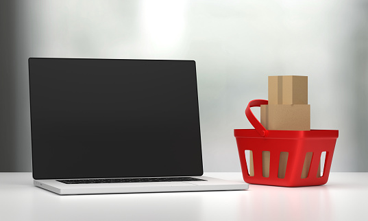 Empty Laptop Screen and Shopping Cart. Online Shopping And Sale Concept.