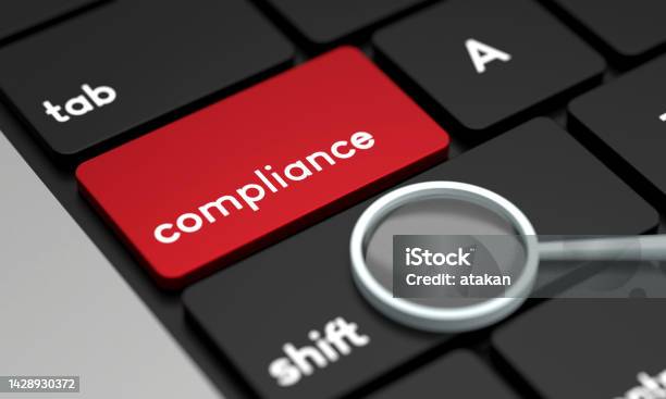 Closeup Laptop Keyboard With Compliance Button And Magnifying Glass Stock Photo - Download Image Now
