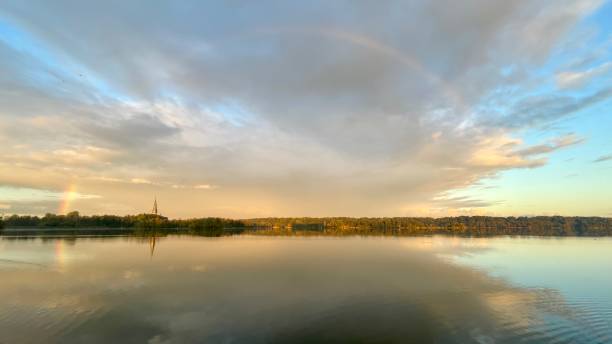 istock Rainbow at a lake in the early morning 1428936619