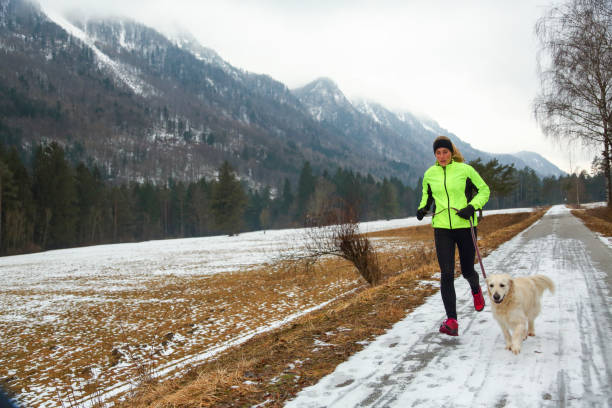istock Running with dog in winter 1428937245