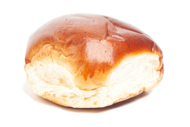 istock fresh baked wheat bun isolated on white 1428939238