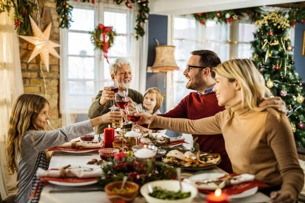 istock Toast during family's Christmas dinner at dining table! 1428939492