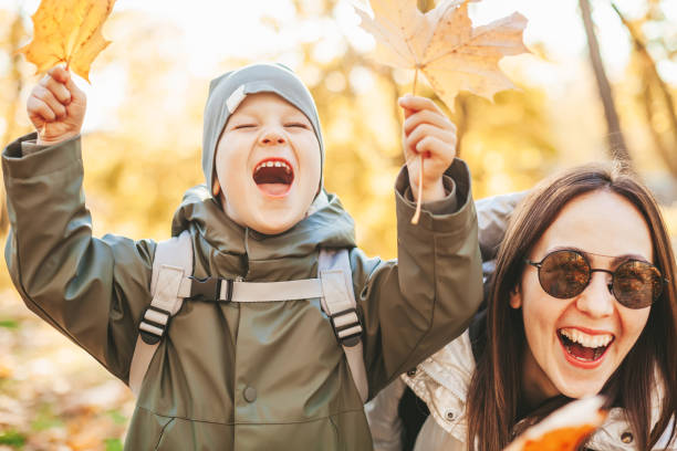 istock Family playing with autumn leaves 1428939852