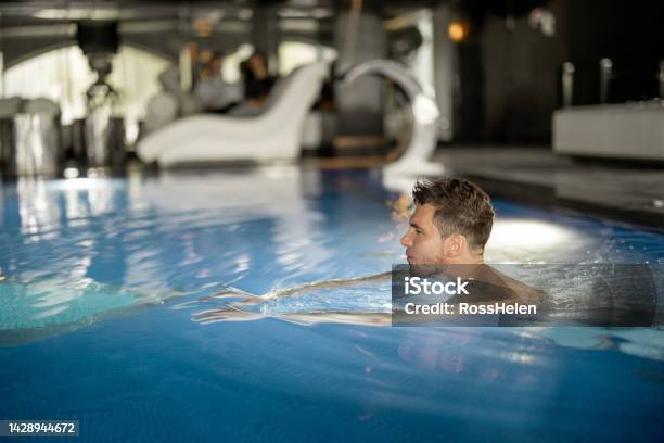 Man At Pool Man Swimming In Pool At Spa Resort Stock Photo - Download Image Now ...