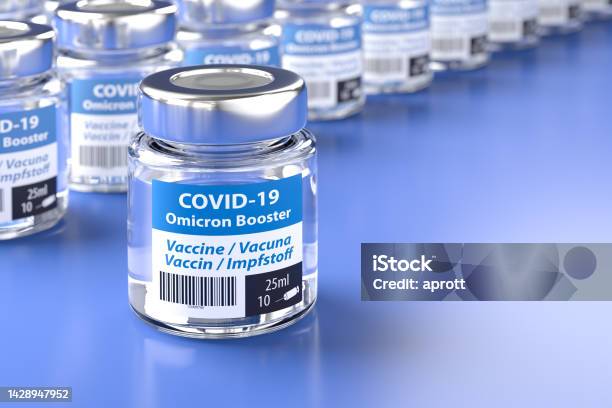 Concept For Availability Of Enough Booster Vaccine Against Covid19 Omicron Variant Bottles Of Vaccination The Word Vaccination In English Spanish French And German On The Label Stock Photo - Download Image Now