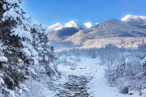 Pikes Peak in the clouds, scene with fresh snow seen from 15 miles northeast in Monument, Colorado, USA, North America