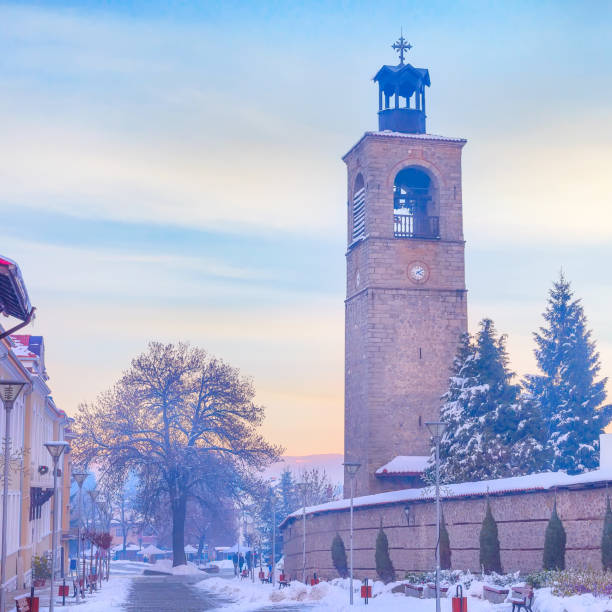 Bansko, Bulgaria downtown, Pirin street, bell tower of Sveta Troitsa Church, evening view