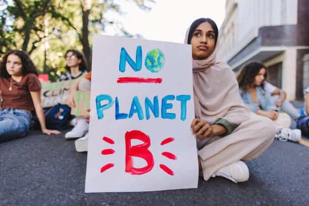 istock Young Muslim girl protesting against global warming 1428954374
