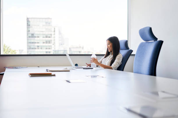 istock Young woman working alone from coworking office 1428955361
