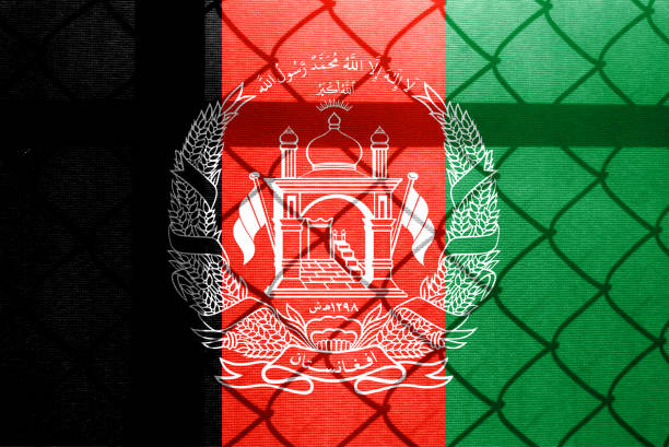 istock Backlight Backlight with physical version of Afghanistan flag and barbed wire. Prison concept with border image. Double exposure hologram. 1428956573