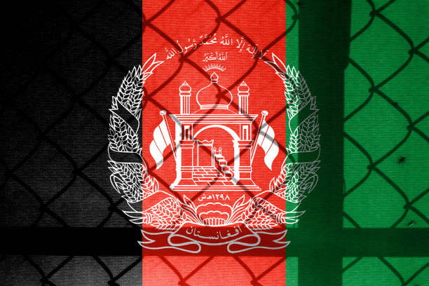 istock Backlight Backlight with physical version of Afghanistan flag and barbed wire. Prison concept with border image. Double exposure hologram. 1428957668