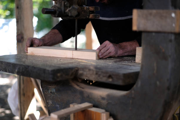 istock Young carpenter using sander while working on a piece of wood 1428960028